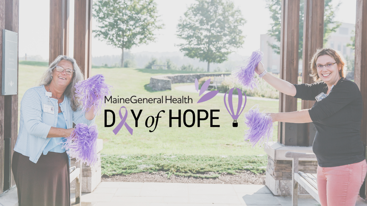 MaineGeneral Health Day of Hope image of two smiling women holding purple pompoms, cheering for cancer fighters and survivors.