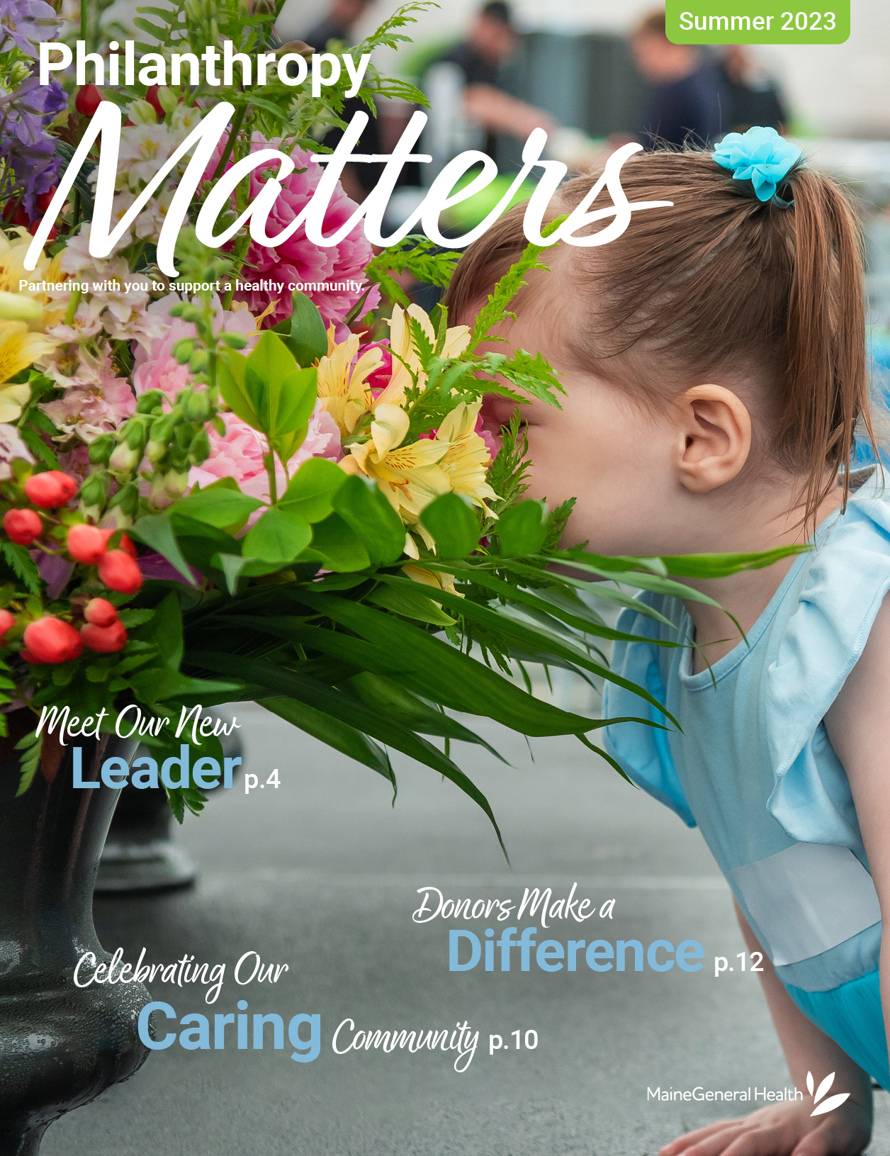 MaineGeneral Health's Philanthropy Matters Summer 2023 front magazine cover. Headlines: Meet Our New Leader page 4. Celebrating Our Caring Community page 10. Donors Make a Difference page 12. Image shows a toddler in a bright blue dress, with hair in pigtails, leaning forward to breathe in the scent of a brightly-colored floral arrangement, burying her face in the blooms. The image is from the 2023 President's Circle event, which honored retiring CEO Chuck Hays, and the toddler is his grandchild.